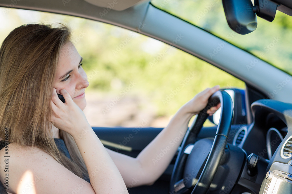 Beautiful business woman driving a car Beautiful business woman driving a car