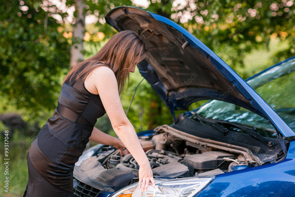 Beautiful business woman near her broken car Beautiful business woman near her broken car