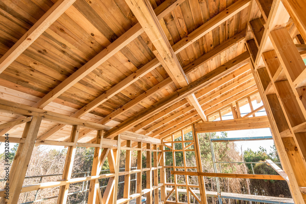 Wooden frame of a new house under construction Wooden frame of a new house under construction