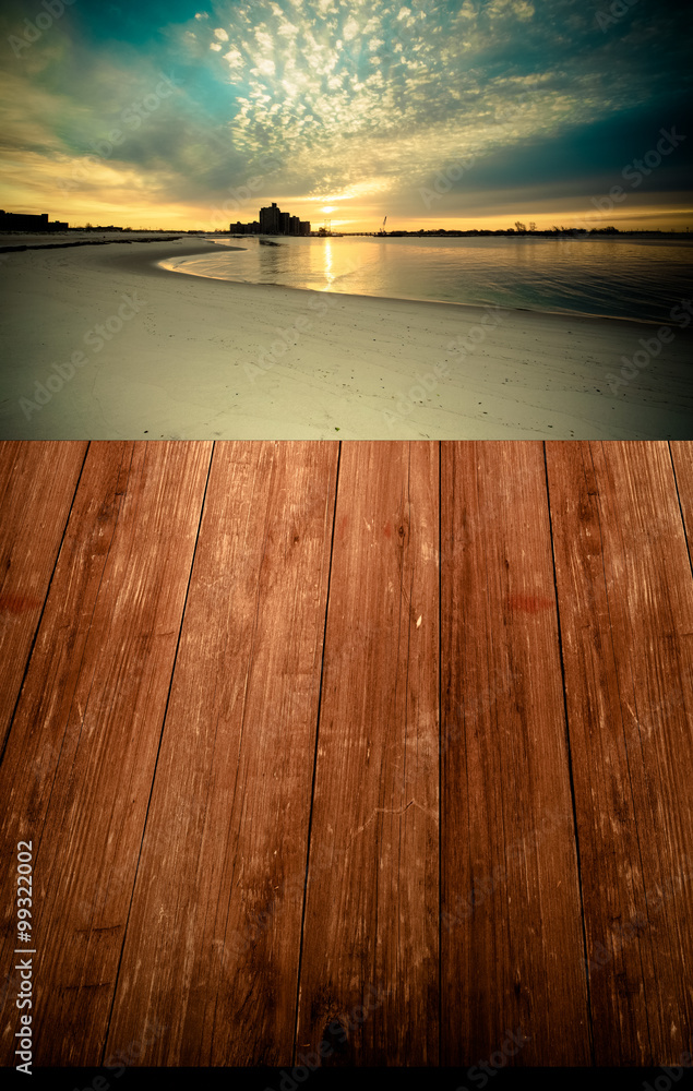 Fototapeta View on warm sunrise on the coast from dark wooden gangway or br