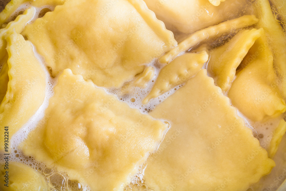 Russian ravioli - pelmeni are boiling in broth . Cooking process Russian ravioli - pelmeni are boiling in broth . Cooking process