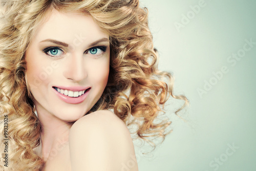 Beauty Portrait of Happy Girl on Light Green Background