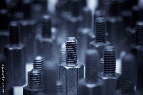 Close-up of metal bolts. Background