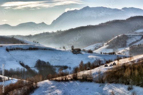 Frozen sunny day of a winter, on wild transylvania hills. Holbav. Romania. Low key, dark background, spot lighting, and rich Old Masters