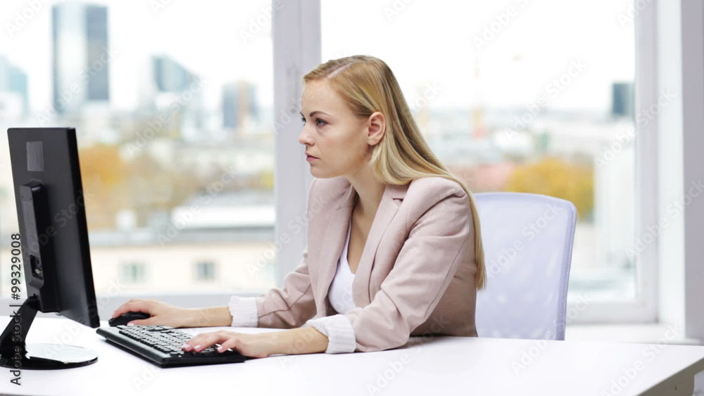 young businesswoman with computer typing at office young businesswoman with computer typing at office