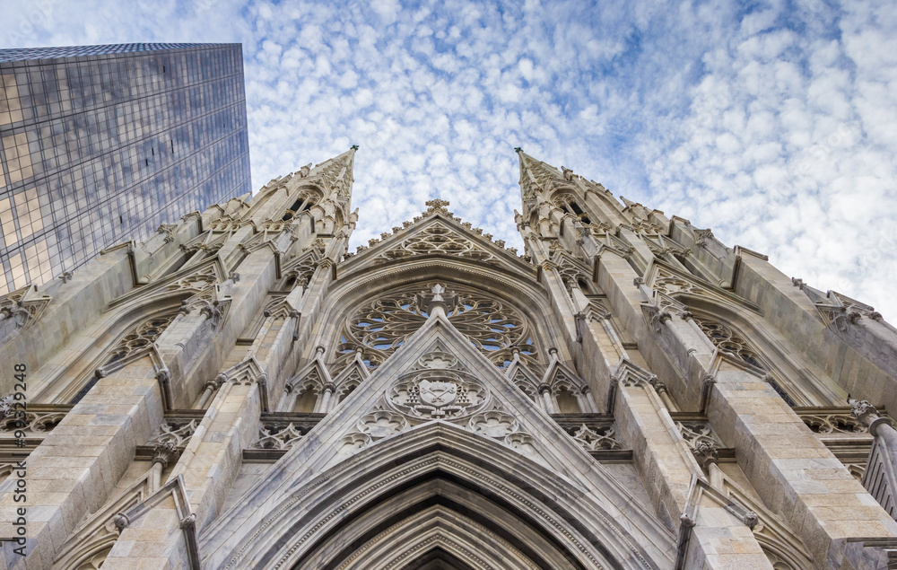 Front of St. Patricks Cathedral and a skyscraper in New York