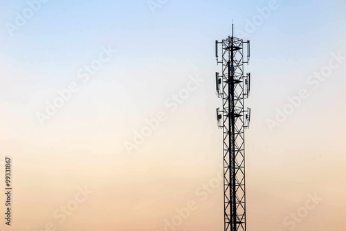 Telecommunication cellular tower on twilight background. Used to