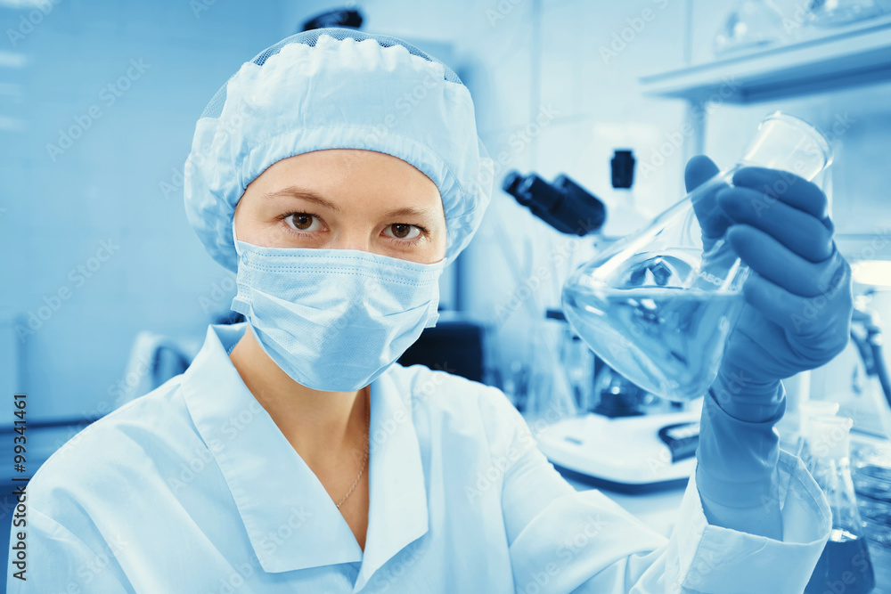 Closeup portrait female scientist holding conical tube with liquid solution, laboratory experiments, isolated lab background. Forensics, genetics, microbiology, biochemistry. Closeup portrait female scientist holding conical tube with liquid solution, laboratory experiments, isolated lab background. Forensics, genetics, microbiology, biochemistry.