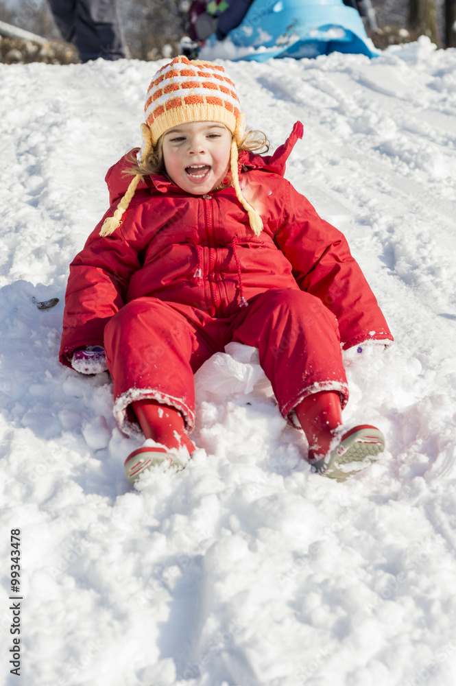 Little girl playing outdoors in snow Little girl playing outdoors in snow