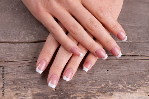 Female hands with french manicure.