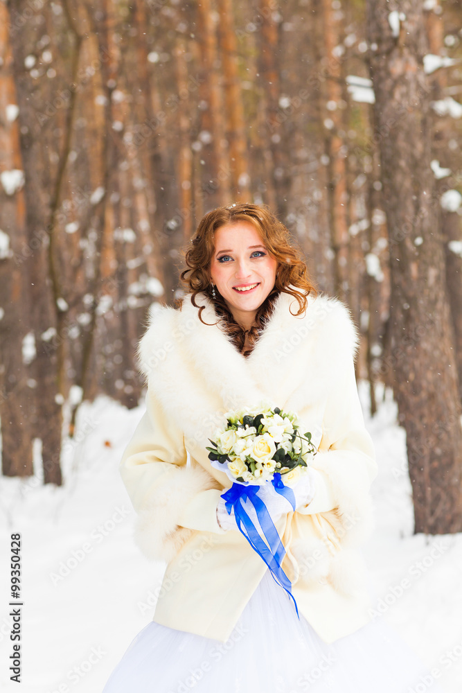 Bride and bridal bouquet in the winter. Bride and bridal bouquet in the winter.