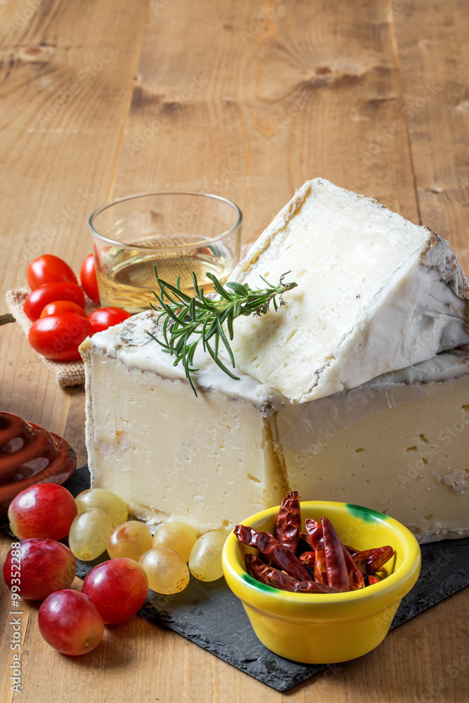 Typical Spanish cheese with wine, grapes and cherry tomatoes