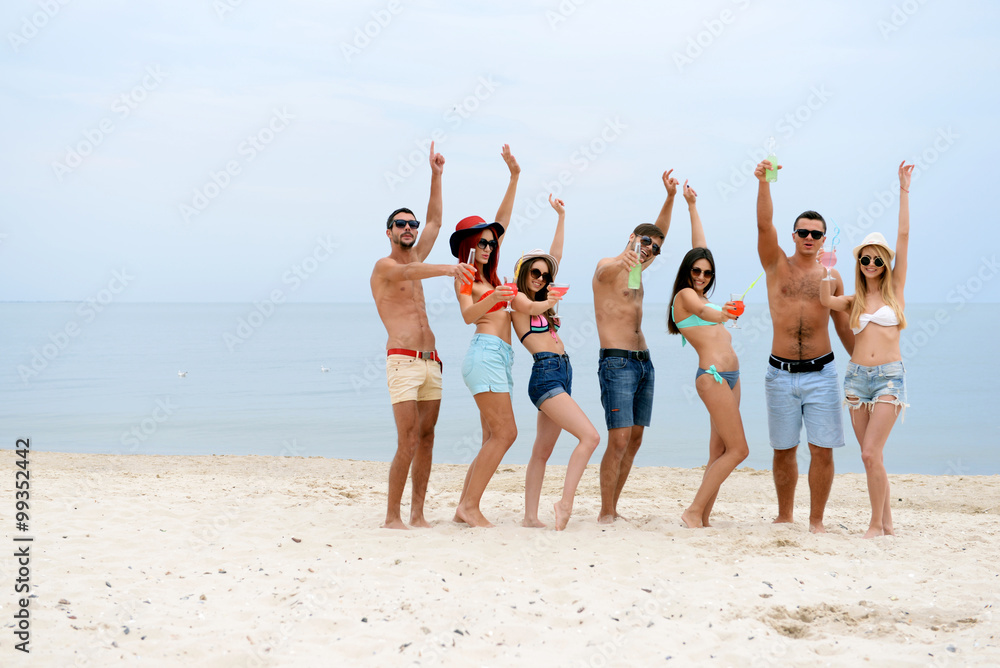 Beautiful young people having fun on beach