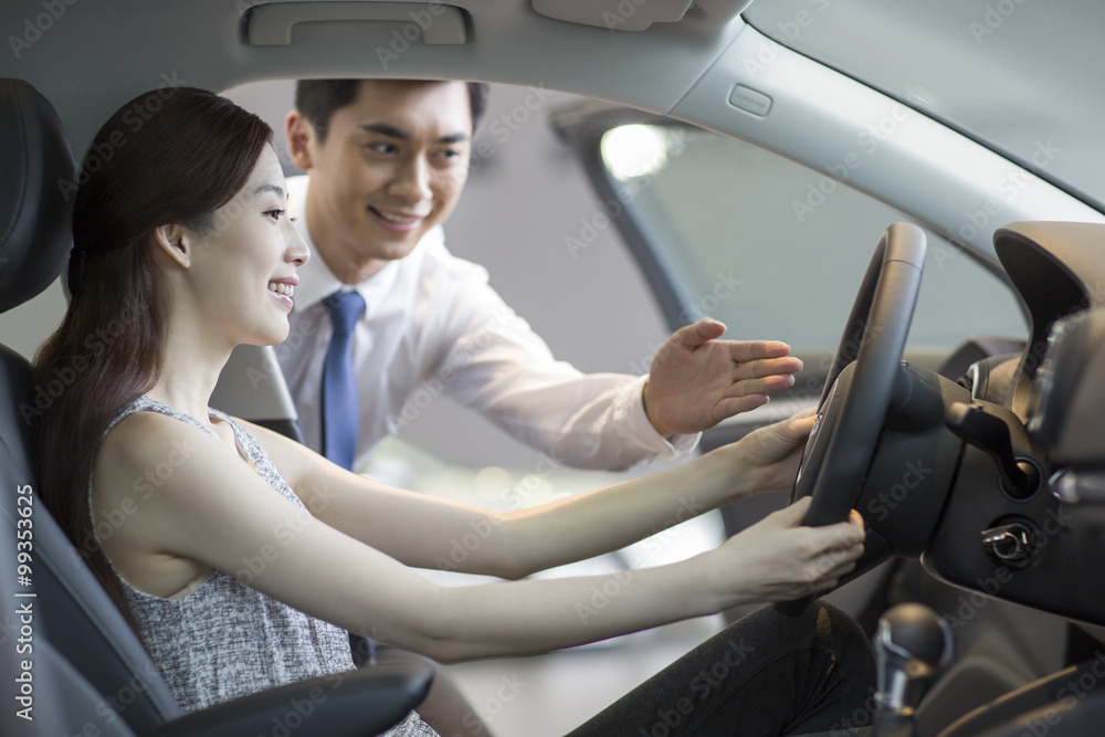 Young woman taking a test drive Young woman taking a test drive