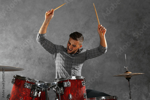 Fotografering Musician playing the drums in a studio