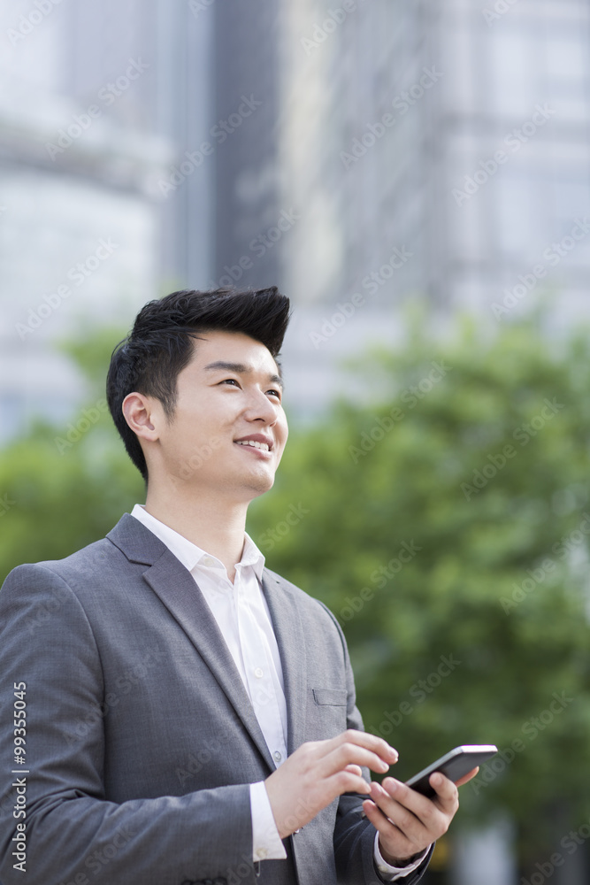Young businessman with smart phone Young businessman with smart phone