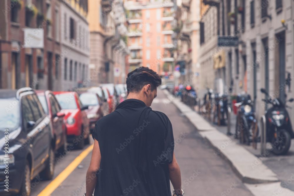 Handsome Asian model posing in the city streets