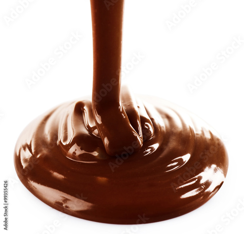 Melted milky brown chocolate pouring, isolated on white