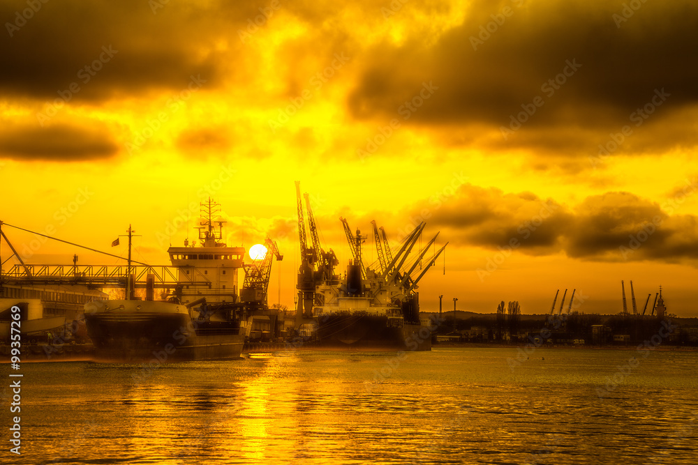 Silhouettes of cranes and ships in port of Gdansk, Poland.