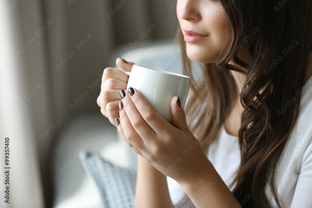 Portrait of pretty young woman with cup of coffee, close up Portrait of pretty young woman with cup of coffee, close up