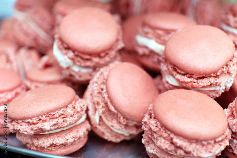 Pink macaroons on plate closeup Pink macaroons on plate closeup