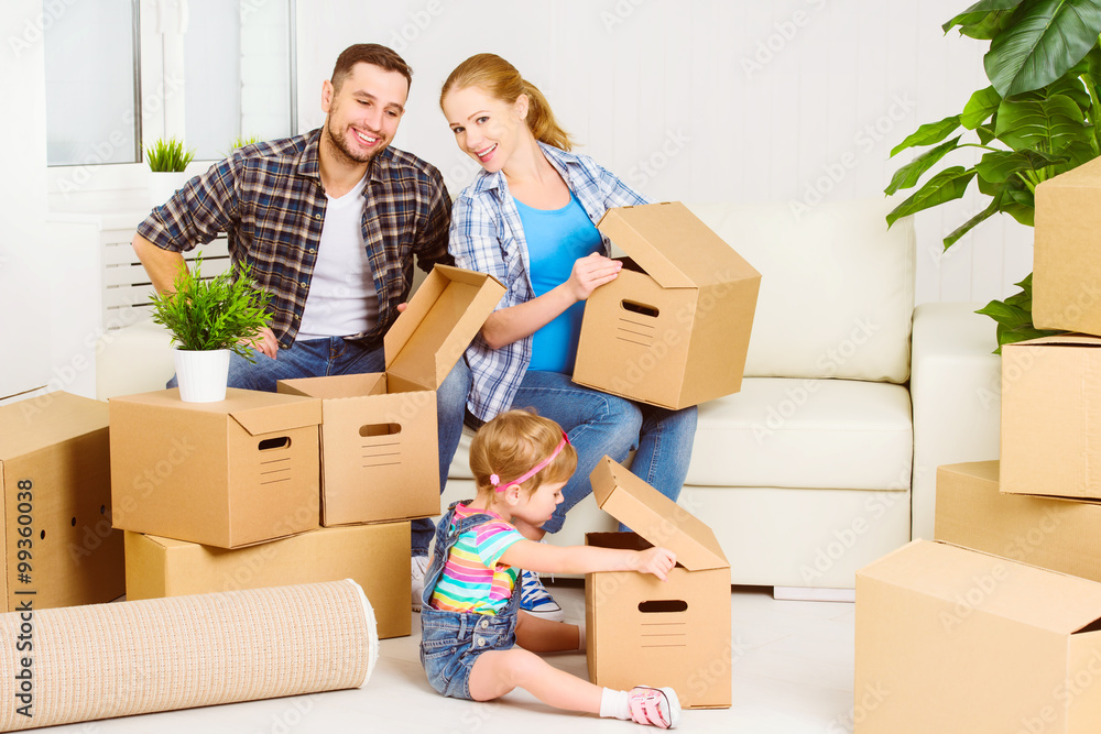 moving to new home. Happy family with cardboard boxes moving to new home. Happy family with cardboard boxes