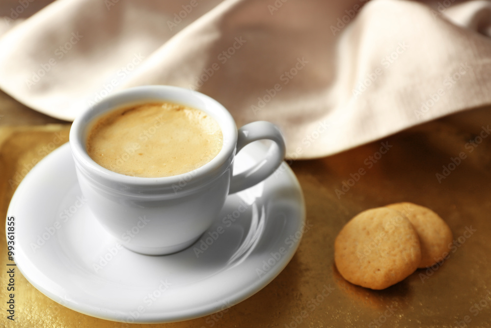 Cup of coffee on tray, on wooden table background Cup of coffee on tray, on wooden table background