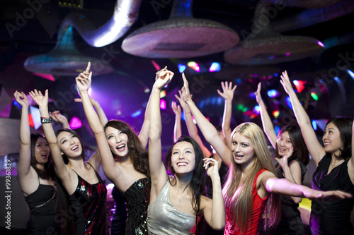 Stylish young people dancing in nightclub