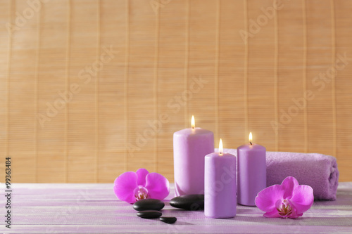 Spa set with flowers on wooden table