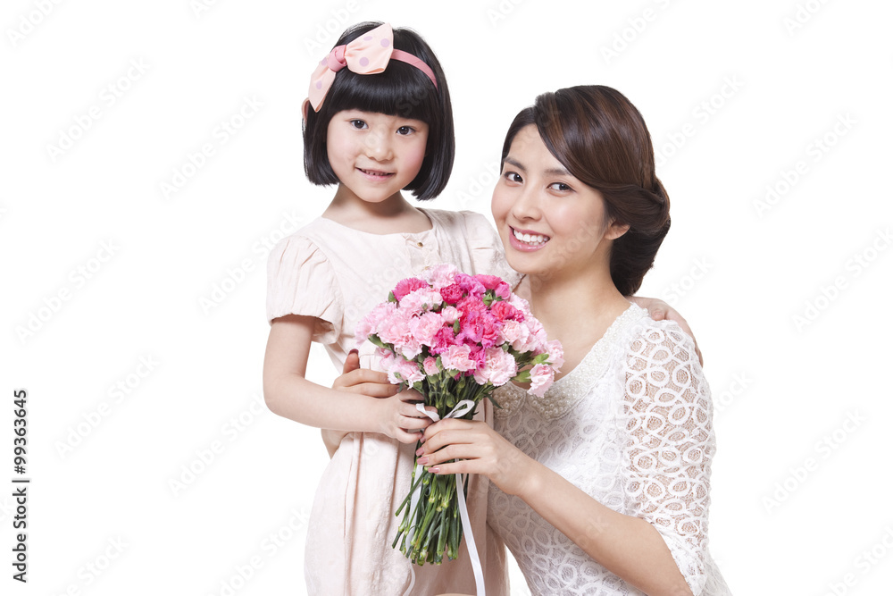 Happy mother and daughter with a bouquet of carnation Happy mother and daughter with a bouquet of carnation