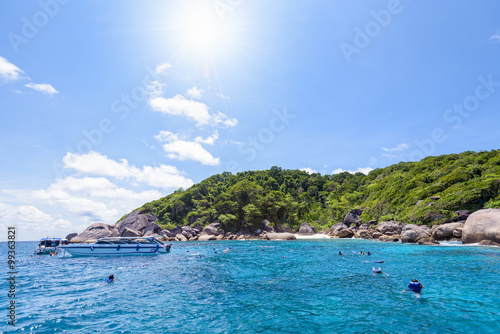Tourists enjoyed snorkelling on blue sea and sky during summer at Ko Ba Ngu Island in Mu Ko Similan National Park, Phang Nga province, Thailand, 16:9 widescreen
