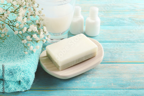 Soap on a dish over wooden background