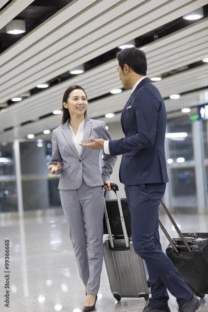 Young business person talking in airport