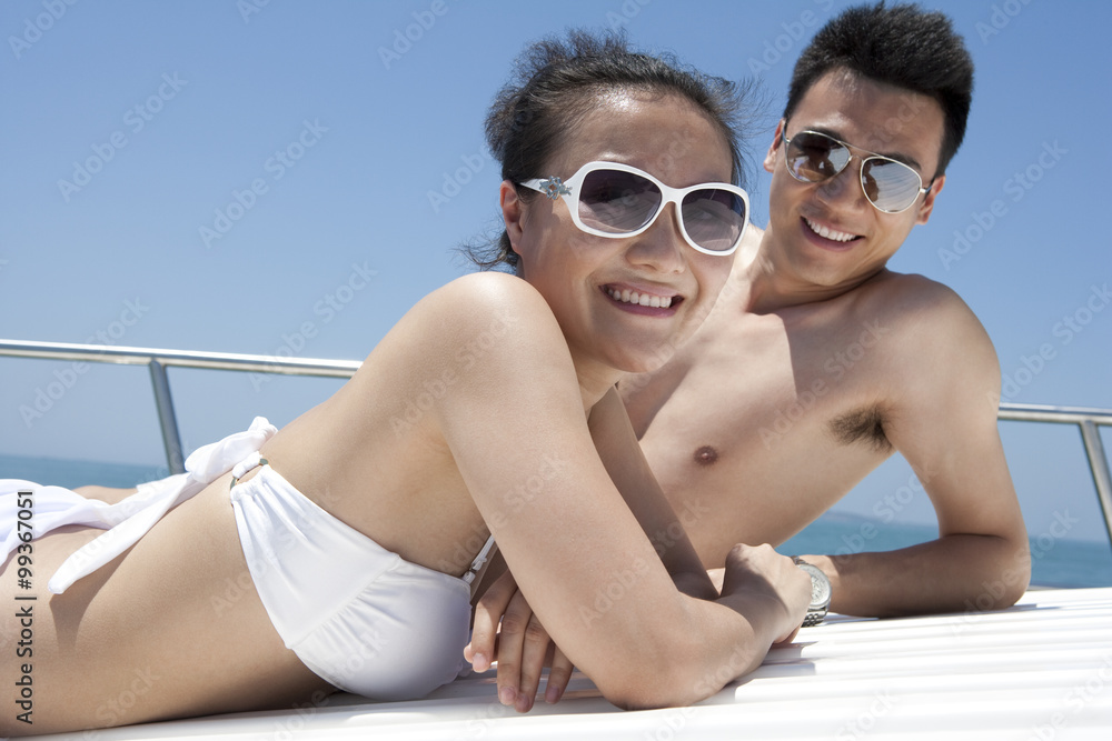 Man and Woman Relaxing on a Yacht Man and Woman Relaxing on a Yacht