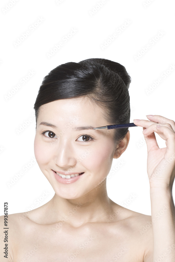 Beauty shot of a young woman with a blusher Beauty shot of a young woman with a blusher