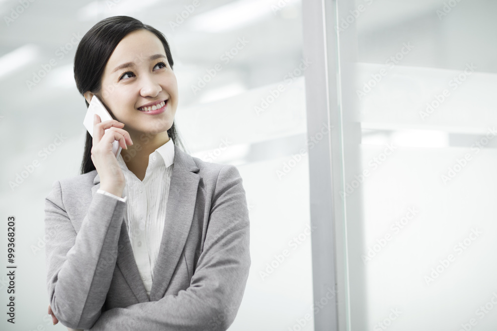Happy businesswoman talking on the phone Happy businesswoman talking on the phone