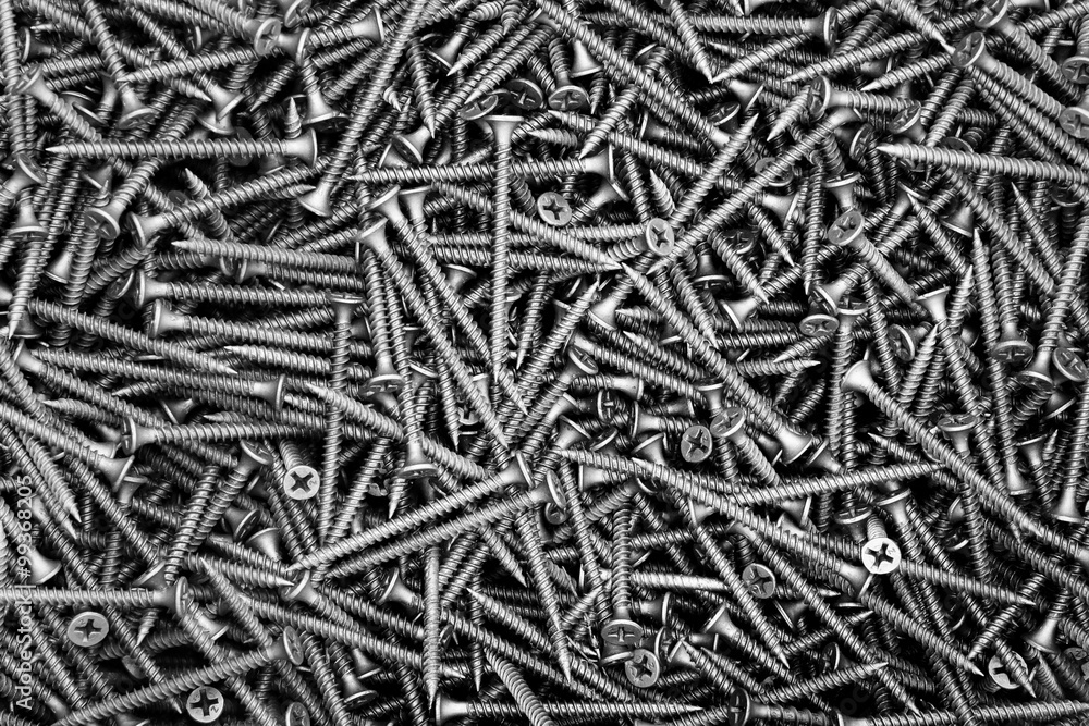 A lot of black screws close-up A lot of black screws close-up
