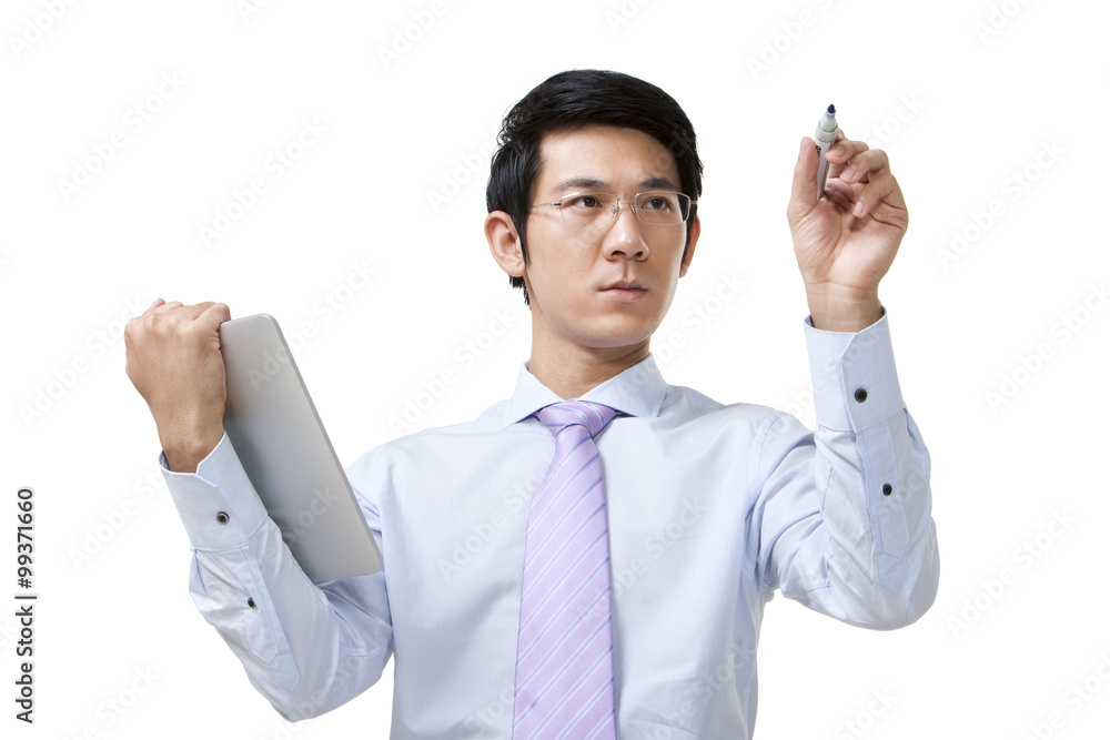 Businessman Writing While Holding a Digital Tablet Businessman Writing While Holding a Digital Tablet