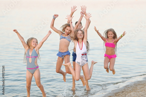Portrait of happy children on nature in summer