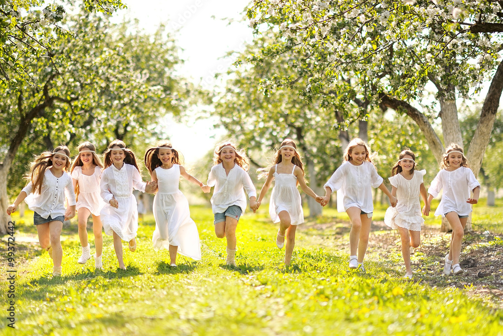 Obraz premium Portrait of happy children on nature in summer
