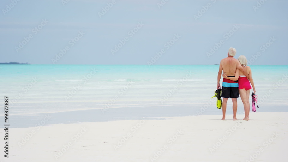 Senior Caucasian couple in swimwear going snorkeling Senior Caucasian couple in swimwear going snorkeling