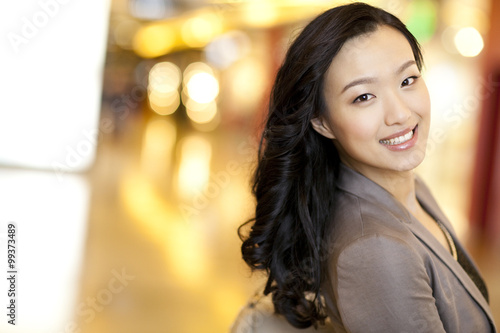 Elegant young woman looking over shoulder