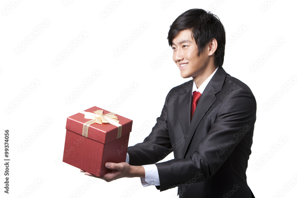 Happy Businessman Holding a Gift Happy Businessman Holding a Gift