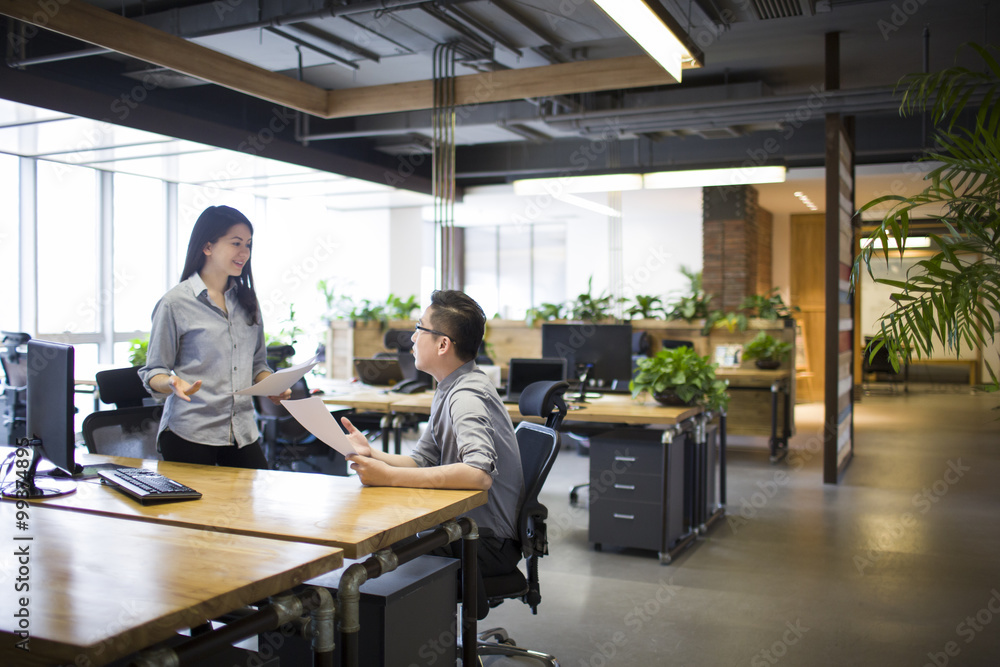 IT workers talking in office