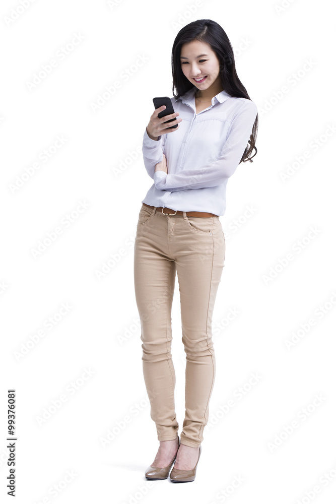 Cheerful young woman text messaging Cheerful young woman text messaging