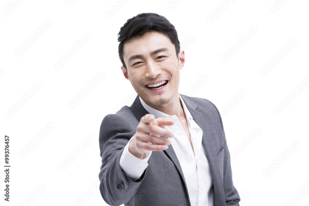 Fashionable businessman pointing forward Fashionable businessman pointing forward