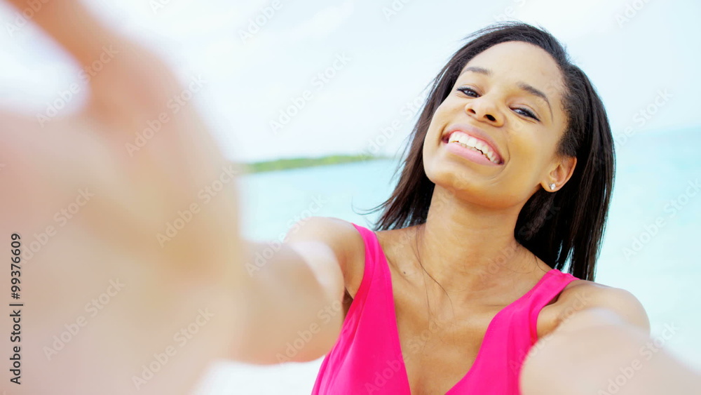 Portrait of smiling African American girl on tropical beach Portrait of smiling African American girl on tropical beach
