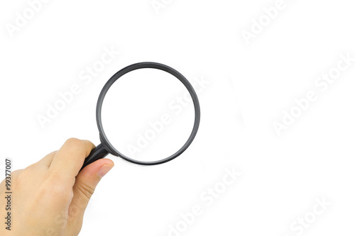 Woman hand holding magnifying glass on white background
