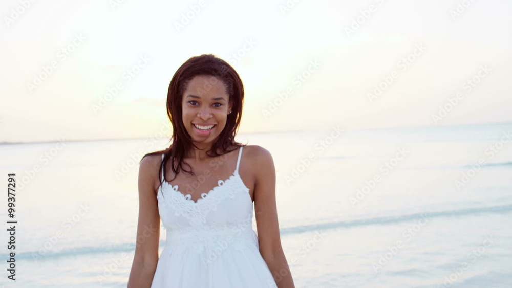 Portrait of happy African American girl on ocean beach vacation Portrait of happy African American girl on ocean beach vacation