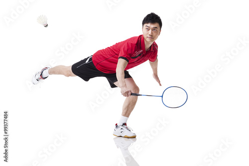 Male athlete playing badminton © Blue Jean Images